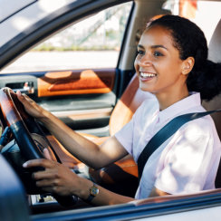 woman driving smiling